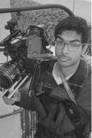 Photo of Muhil Vaseekaran as Dr. Moo / Bartender