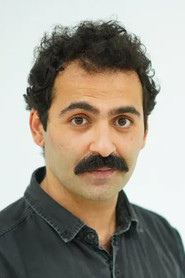 Photo of Fırat Bozan as Hikmet