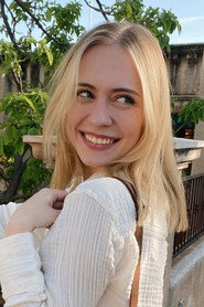 Photo of Noell Komar as The Interviewer