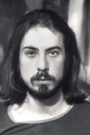Photo of Larry Burns as (archive footage)