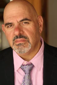 Photo of Phil Idrissi as Lenny Driscoll