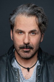 Photo of Michael Kelly as Jim Larochelle