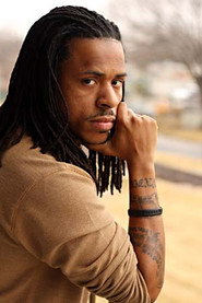 Photo of Ya'Ke Smith as Man in Front of Bus Station