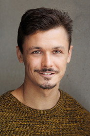 Photo of Adam Golledge as Rio Palmer