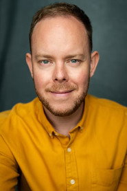 Photo of James Robert-Moore as James (archive footage) (uncredited)