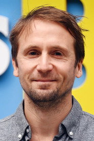 Photo of Tom Basden as Herb McGwyer