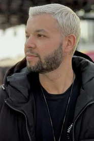 Photo of Joel Junior as Stranger in a suit