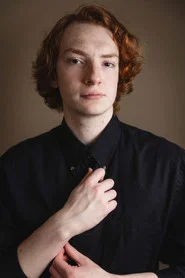 Photo of Dylan Miguel Argo as Liam