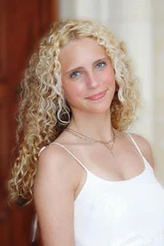 Photo of Riley Beeson as Esther Miller - Young Naomi Miller