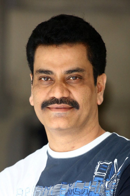 Photo of Dr. Mohan, Acting