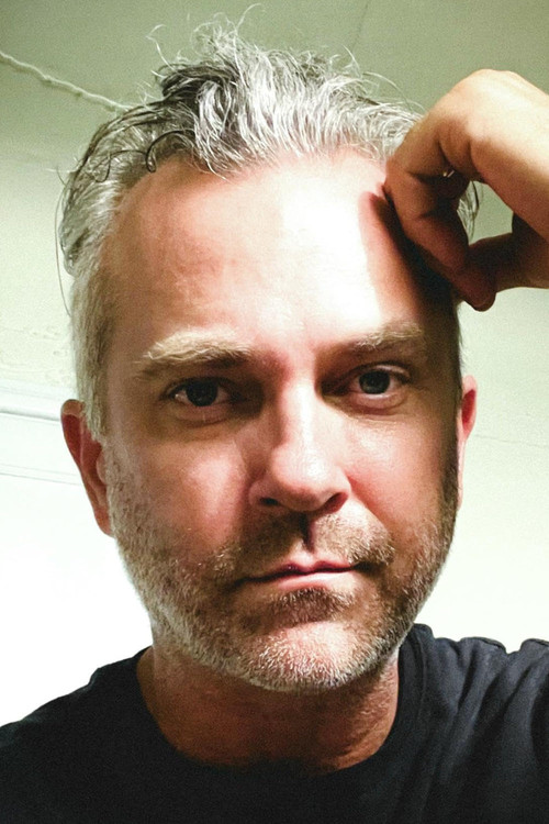 Photo of Joshua Weigel, Writing
