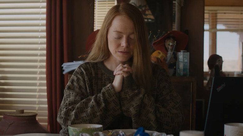 The sun setting over a barricaded town square