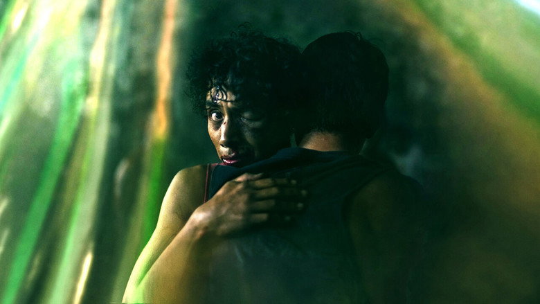 A corpse floats in murky water, the camera lingering just long enough to make the viewer complicit in the horror.
