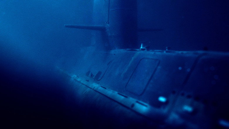 A dimly lit control room of the ARA San Juan, its instruments glowing faintly in the darkness.