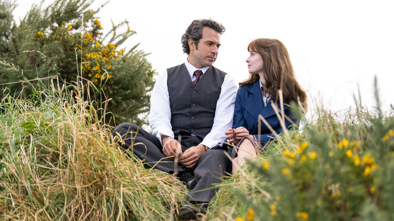 Cushla looking out a rain-streaked window