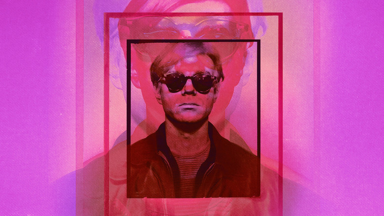 A close-up of Warhol’s face, half in shadow, his silver wig catching the light like a halo—or a mask.