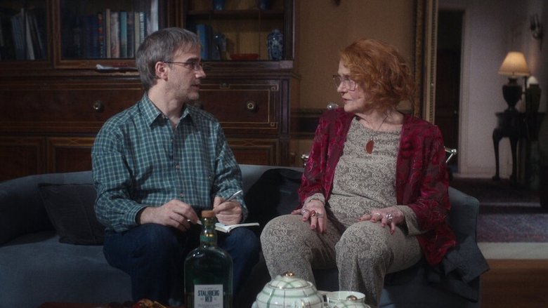 Martha Hoffman in her sunlit apartment, cigarette in hand, mid-conversation