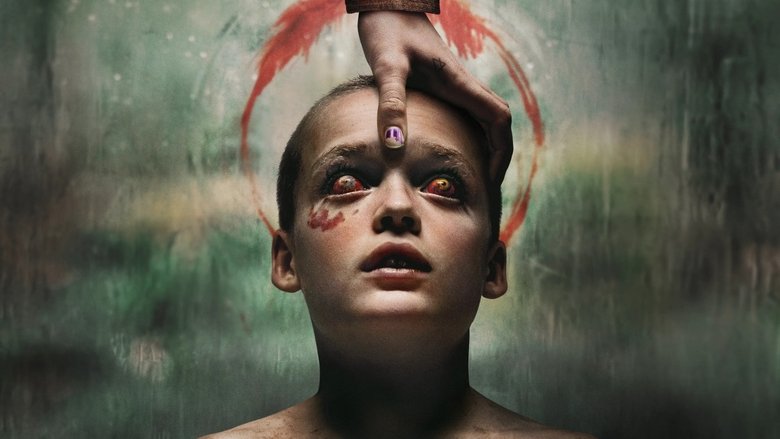 Andy standing in the dark hallway