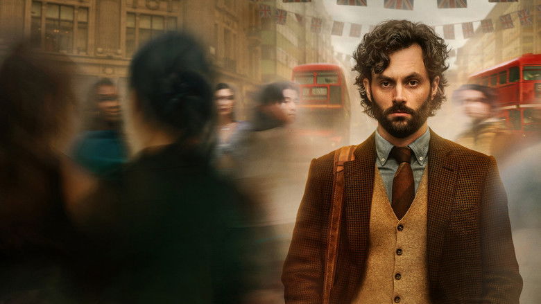 Joe in a dark room holding a phone