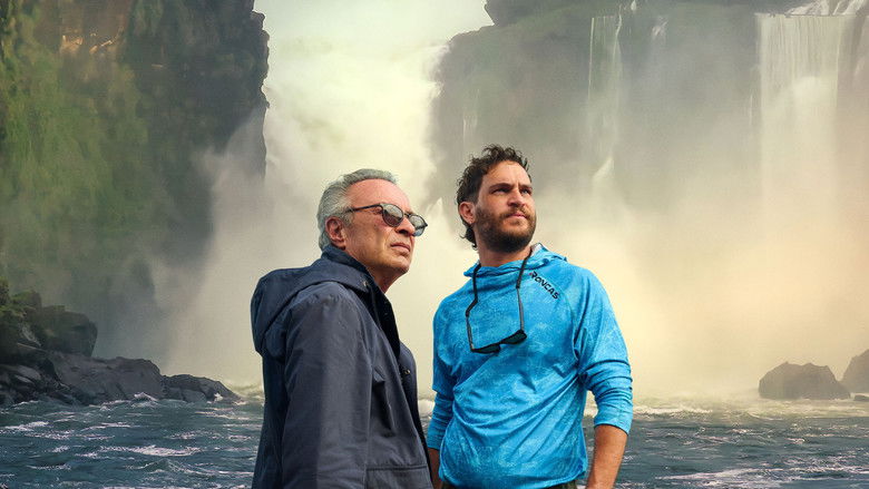 A wide, melancholic shot of a city street at twilight, emphasizing the vast, empty space between two figures