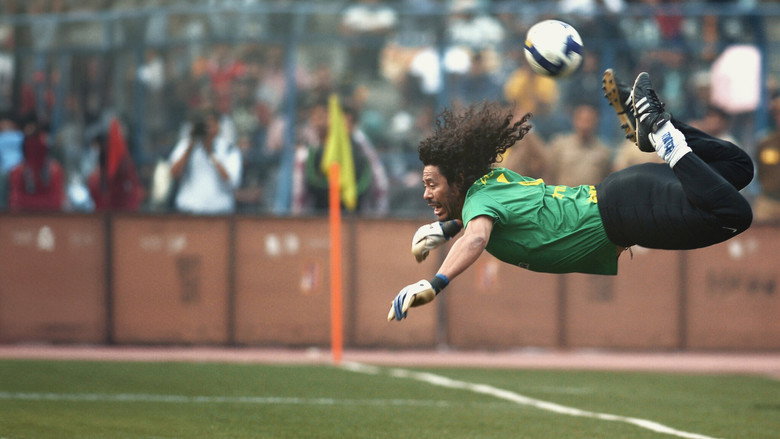 René Higuita mid-scorpion kick, his body arched backward as the ball hovers just above his heels