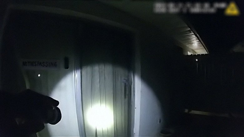 A bodycam still showing a group of children playing in a Florida neighborhood, their faces blurred but their joy unmistakable.