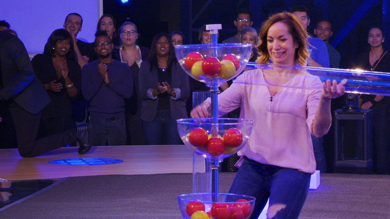 Contestants in a brightly lit studio, their faces slack with exhaustion, staring blankly at a challenge board