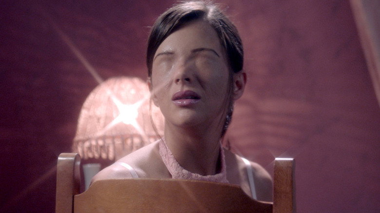 A close-up of Ana, her face half-obscured by a microphone, her expression caught between hope and hesitation