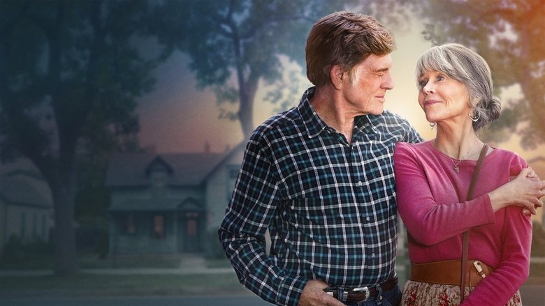 Addie and Louis walking through a sun-drenched, quiet street in their small Colorado town.