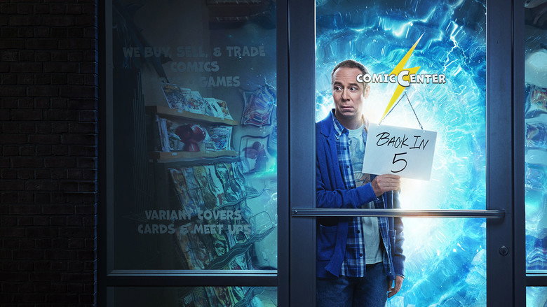 Stuart standing in a dimly lit comic book store, surrounded by towering shelves of comics, looking overwhelmed by a glowing device in his hands.