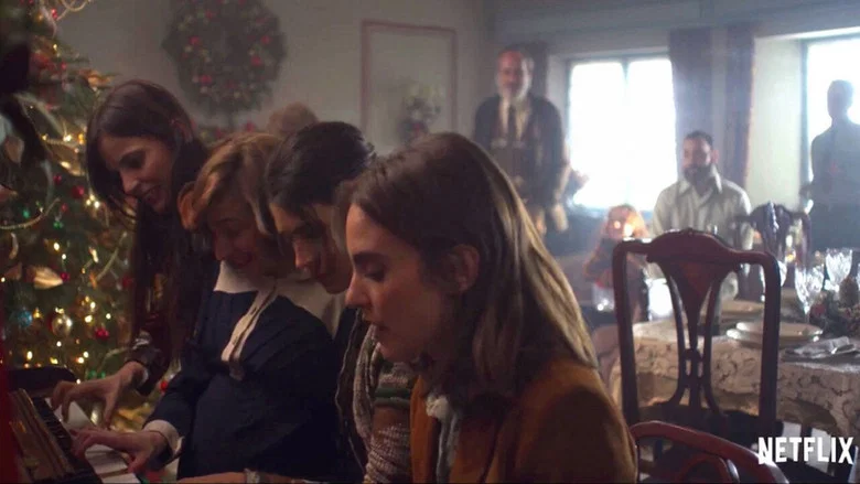 The family home, half-buried in snow, its windows glowing like embers in the dark.