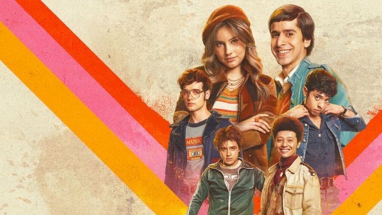 The students in the classroom, looking toward the door.