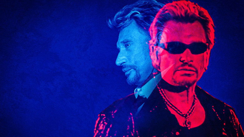 A grainy black-and-white shot of Johnny Hallyday on stage, his body angled toward the microphone, one hand gripping it like a lifeline, the other raised in a gesture that’s half-defiance, half-surrender.