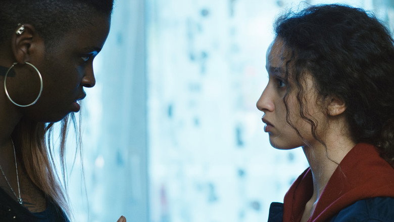 Dounia and Maimouna sprinting through the concrete maze of the banlieue, their faces set with determination