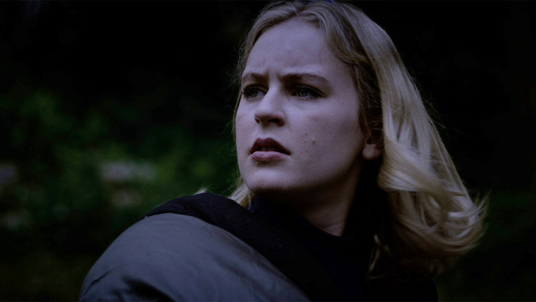 Campers gathered around a lantern, unaware of the danger just beyond the light