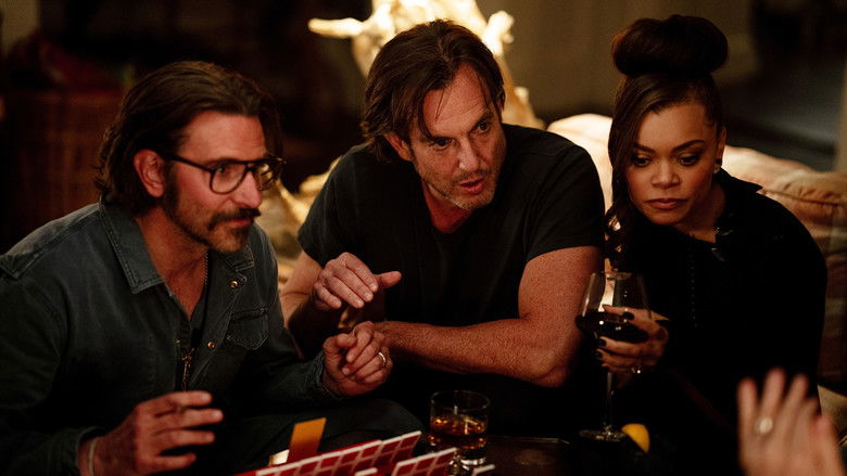 Two people sitting across from each other in a dimly lit diner