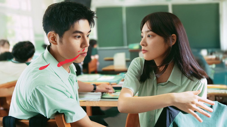 The two Ye Zijies sit on opposite ends of a classroom desk, their reflections warped in the curved surface of a fish tank, as if the water itself is bending their identities into one.