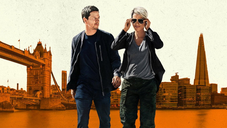 Mark Wahlberg and Halle Berry in a tense moment, surrounded by high-tech espionage equipment