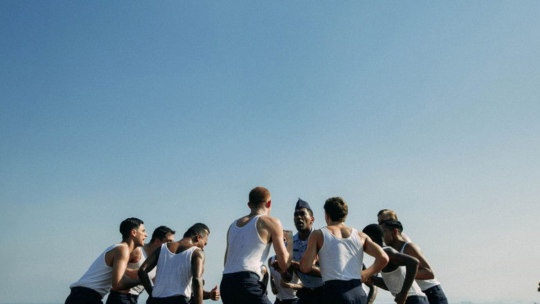 A wide shot showing the silhouette of a performer standing on a stage, isolated against a vast, colorful backdrop of stage lights