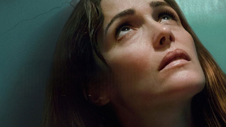 Linda sitting on the edge of a motel bed