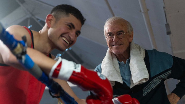 A gym setting with a trainer and boxer preparing for a spar, capturing the gritty atmosphere of the training sessions.