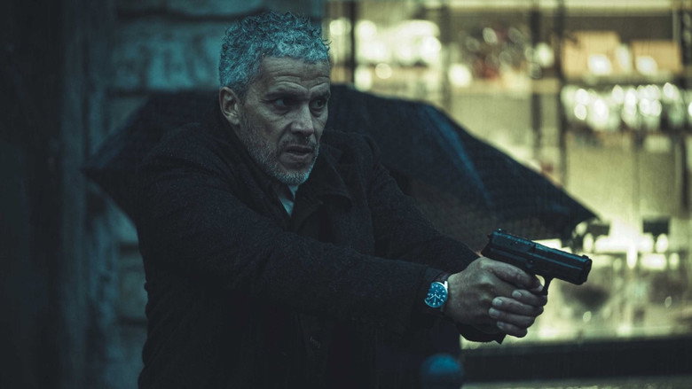 Malik examining a clue in the dark