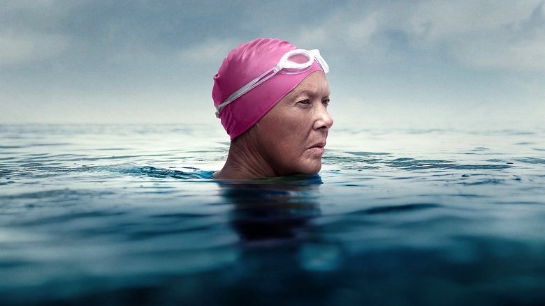 Annette Bening as Diana Nyad, mid-swim, her face streaked with salt and exhaustion, the ocean stretching endlessly around her