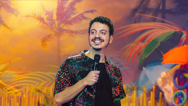 A chaotic scene with Rodrigo Marques at the center, surrounded by props and bright colors, suggesting a comedic breakdown or revelation