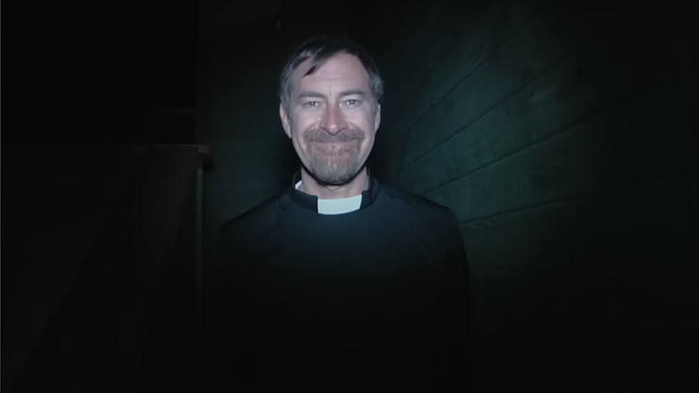 A shadowy figure in a doorway