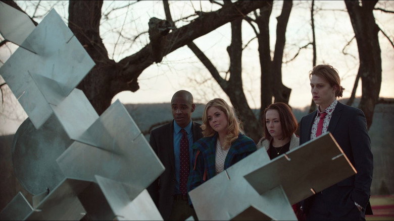 The four teens huddled in a parking lot, staring up at the U.S. Mint like it’s an impossible dream.
