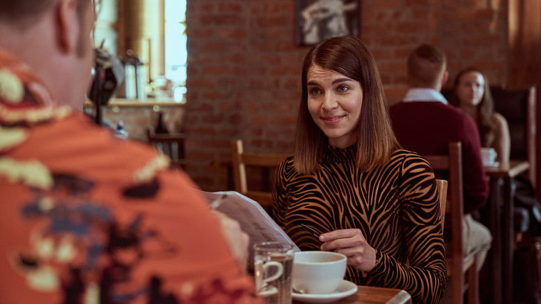 Johanne sitting by a window