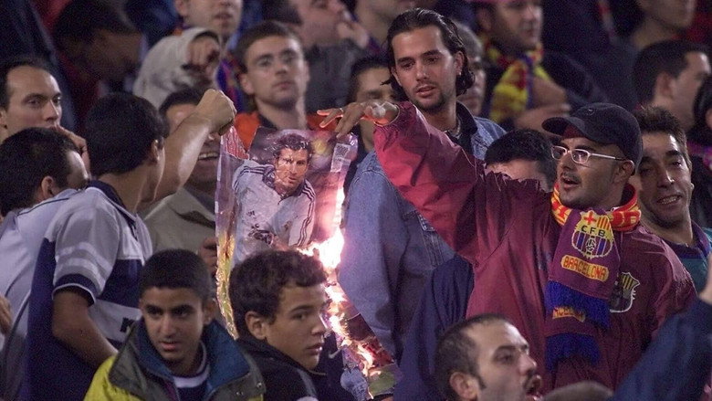 A tense press conference with Luís Figo seated between club officials, his expression unreadable