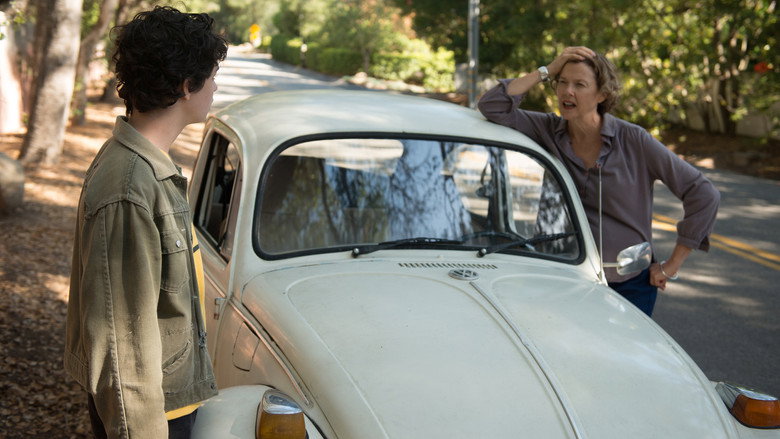 A warm, sunlit scene of Dorothea (Annette Bening) and Jamie (Lucas Jade Zumann) sitting on a bed, their faces half in shadow, the weight of unspoken words hanging between them.