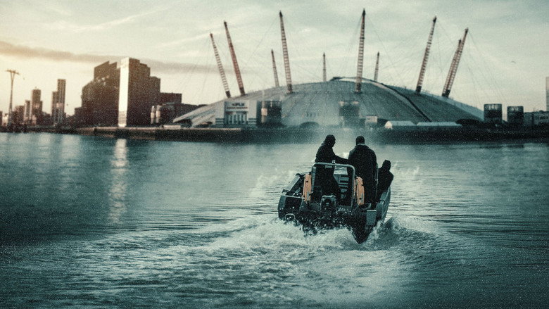 A reenactment of the crew’s failed escape, the speedboat cutting through the Thames under a gray London sky
